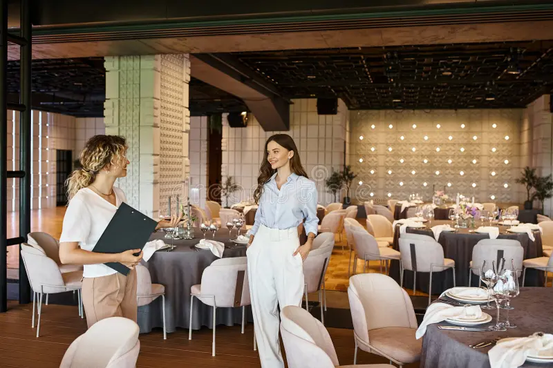 event coordinator clipboard showing modern banquet hall decorated tables to young woman stock photo 291867141